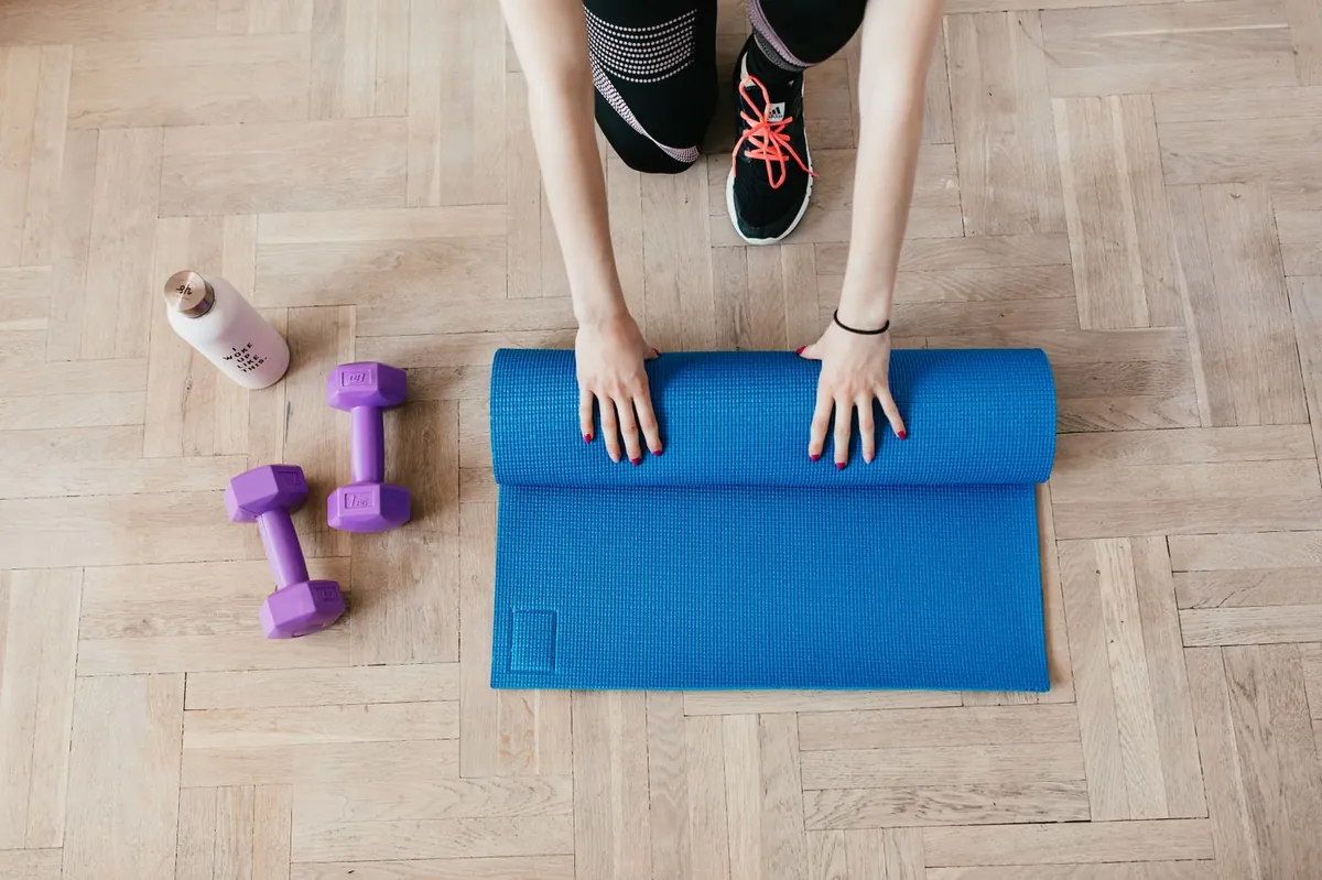 Adult stretching on a mat — distinct from Core Relief.
